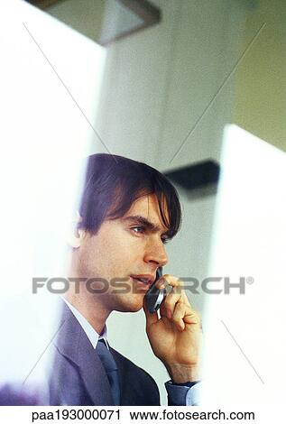 Businessman talking on cell phone, partial view, head and shoulders. View Large Photo Image Stock Image - Businessman talking on cell phone, partial view, head and shoulders.. Fotosearch