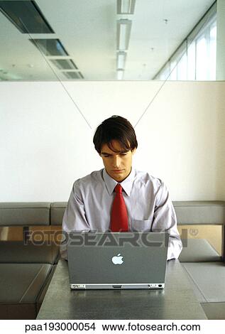 Businessman working on laptop. View Large Photo Image Picture - Businessman working on laptop.. Fotosearch