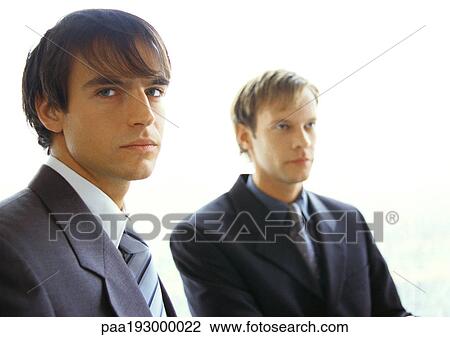Businessmen sitting next to each other. View Large Photo Image Stock Image - Businessmen sitting next to each other.. Fotosearch