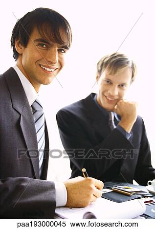 Stock Photography - Businessmen smiling at camera. Fotosearch