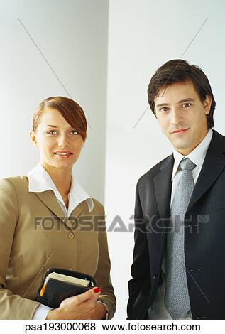 Businesswoman standing next to businessman, waist up. View Large Photo Image Stock Photo - Businesswoman standing next to businessman, waist up.. Fotosearch