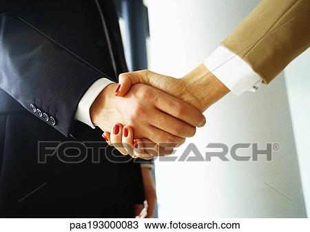 Man and woman shaking hands View Large Photo Image Stock Image - Man and woman shaking hands. Fotosearch