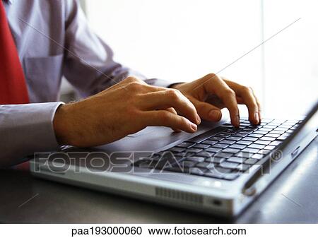 Man's hands on keyboard of laptop computer. View Large Photo Image Stock Image - Man's hands on keyboard of laptop computer.. Fotosearch