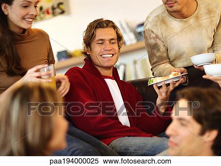 Group of young people sitting together, smiling, close-up. View Large Photo Image Stock Photography - Group of young people sitting together, smiling, close-up.. Fotosearch