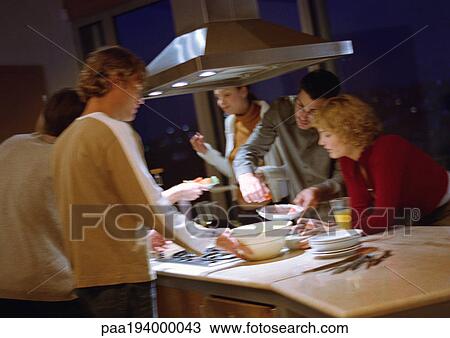 People cooking together in kitchen. View Large Photo Image Stock Image - People cooking together in kitchen.. Fotosearch