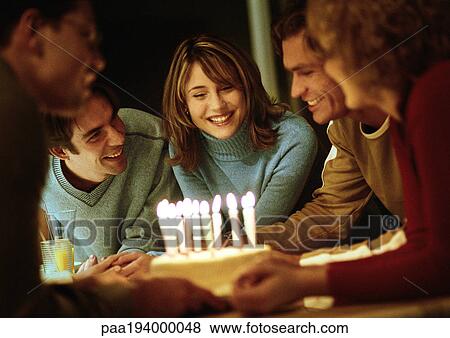 People gathered around birthday cake. View Large Photo Image Stock Photo - People gathered around birthday cake.. Fotosearch