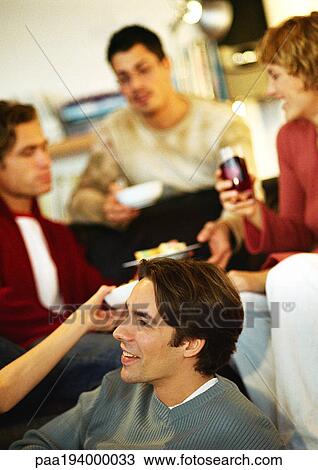 People sitting together eating and talking. View Large Photo Image Stock Image - People sitting together eating and talking.. Fotosearch