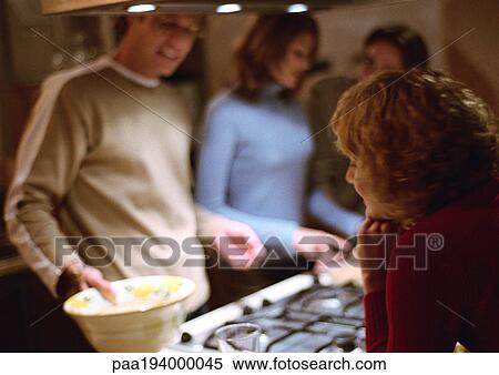 People together in kitchen. View Large Photo Image Stock Photography - People together in kitchen.. Fotosearch