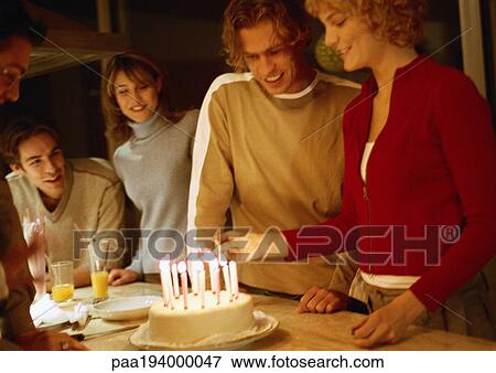 Woman lighting birthday candles in group. View Large Photo Image Stock Photo - Woman lighting birthday candles in group.. Fotosearch