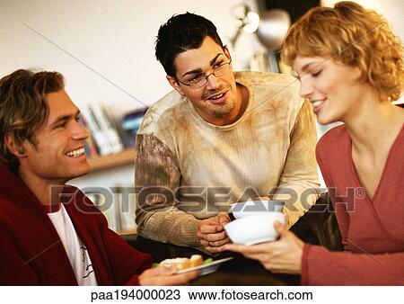 Young people holding dishes View Large Photo Image Stock Image - Young people holding dishes. Fotosearch