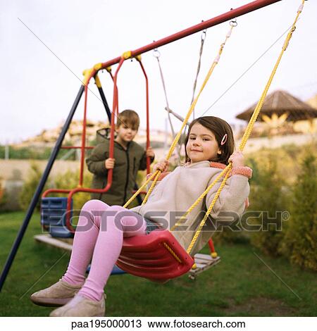 Children playing on swings. View Large Photo Image Stock Image - Children playing on swings.. Fotosearch