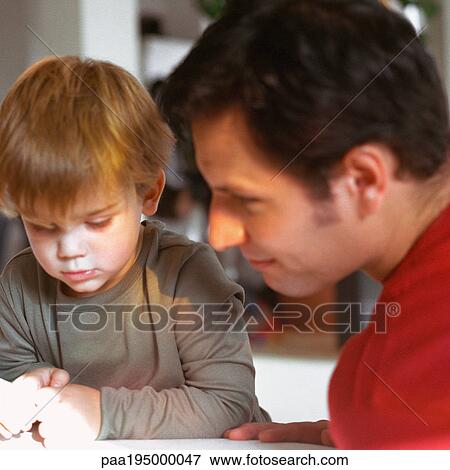 Stock Photo - Father and son, close-up, portrait. Fotosearch