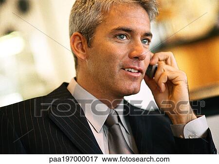 Businessman talking on cell phone, head and shoulders. View Large Photo Image Stock Photo - Businessman talking on cell phone, head and shoulders.. Fotosearch