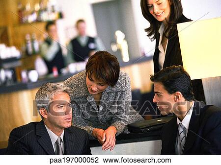 Businesspeople talking together. View Large Photo Image Stock Image - Businesspeople talking together.. Fotosearch