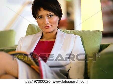 Businesswoman sitting looking at camera, portrait. View Large Photo Image Stock Image - Businesswoman sitting looking at camera, portrait.. Fotosearch