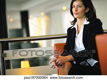 Businesswoman waiting in lobby area. View Large Photo Image Picture - Businesswoman waiting in lobby area.. Fotosearch