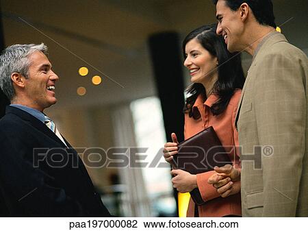 Group of business people laughing together. View Large Photo Image Stock Image - Group of business people laughing together.. Fotosearch