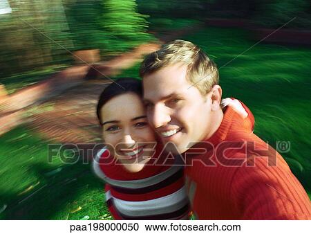 Man and woman standing cheek to cheek, blurred. View Large Photo Image Stock Image - Man and woman standing cheek to cheek, blurred.. Fotosearch
