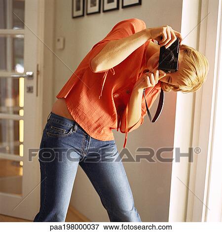 Young woman taking photo View Large Photo Image Stock Photo - Young woman taking photo. Fotosearch
