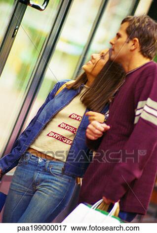 Young couple window shopping. View Large Photo Image Stock Photo - Young couple window shopping.. Fotosearch