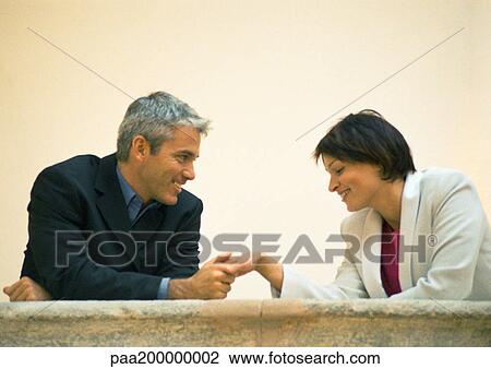 Businessman holding woman's hand View Large Photo Image Stock Image - Businessman holding woman's hand. Fotosearch