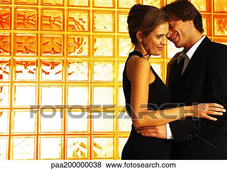 Man and woman dressed up, holding each other. View Large Photo Image Stock Photo - Man and woman dressed up, holding each other.. Fotosearch