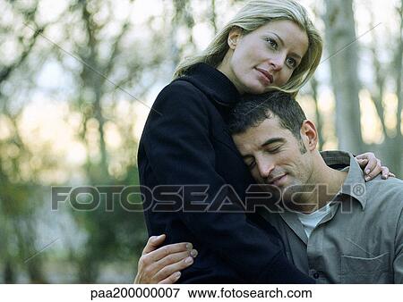 Stock Photo - Man and woman embracing. Fotosearch