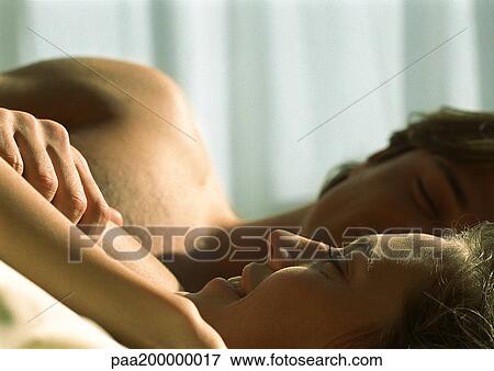Man and woman lying next to each other, close up. View Large Photo Image Stock Photo - Man and woman lying next to each other, close up.. Fotosearch