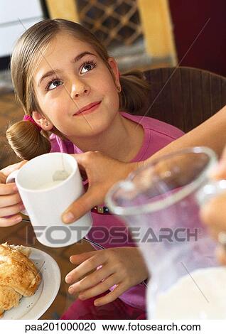 Child looking up, being handed a mug View Large Photo Image Stock Image - Child looking up, being handed a mug. Fotosearch