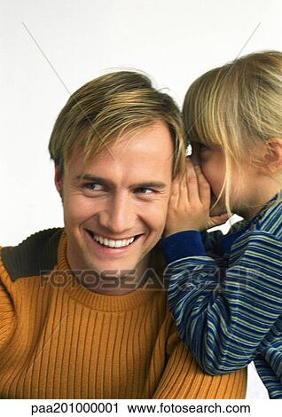 Child, side view, whispering into young man's ear, head and shoulders, close-up View Large Photo Image Stock Image - Child, side view, whispering into young man's ear, head and shoulders, close-up. Fotosearch
