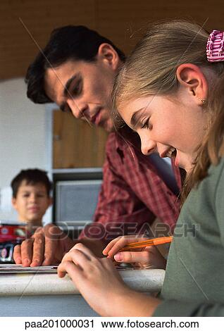 Father helping daughter, son in background blurred. View Large Photo Image Stock Image - Father helping daughter, son in background blurred.. Fotosearch