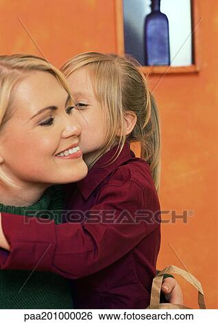 Little girl with arm around young woman, head and shoulders, close-up View Large Photo Image Stock Photograph - Little girl with arm around young woman, head and shoulders, close-up. Fotosearch