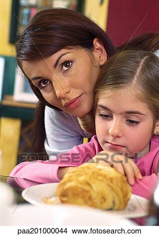 Mother sitting close to daughter. View Large Photo Image Picture - Mother sitting close to daughter.. Fotosearch