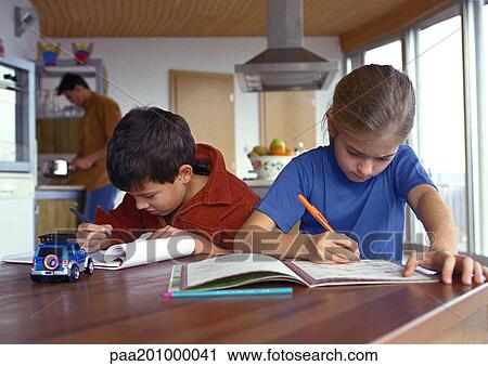 Son and daughter writing at table, father in background cooking, blurred. View Large Photo Image Stock Image - Son and daughter writing at table, father in background cooking, blurred.. Fotosearch