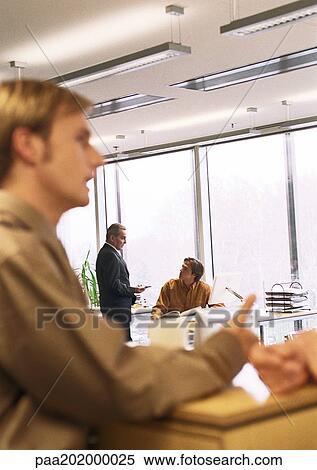 Businesspeople in office View Large Photo Image Stock Photography - Businesspeople in office. Fotosearch
