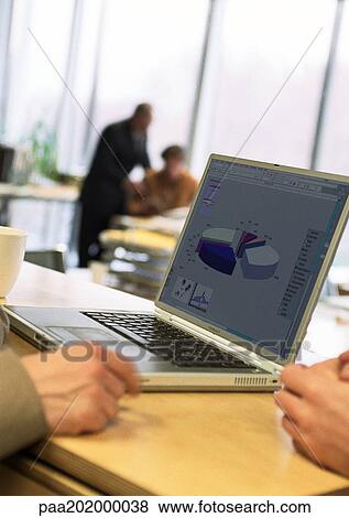 Stock Photo - People working in office. Fotosearch