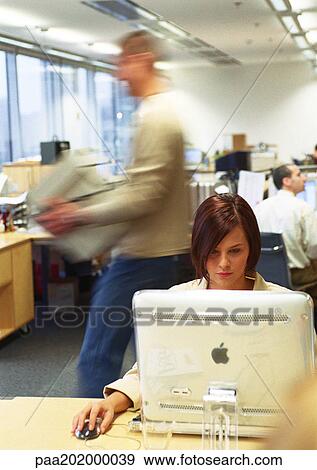 Stock Photo - People working in office. Fotosearch