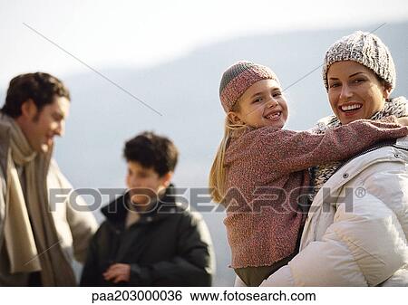 Family in warm clothes, outside. View Large Photo Image Stock Photograph - Family in warm clothes, outside.. Fotosearch