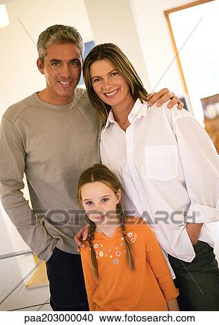 Stock Image - Family standing, portrait.. Fotosearch