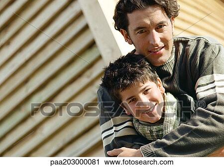 Father and son in warm clothes, portrait. View Large Photo Image Stock Image - Father and son in warm clothes, portrait.. Fotosearch