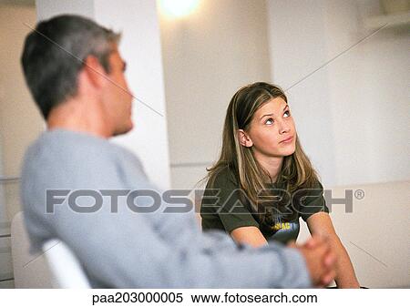 Man and daughter sitting, man looking at daughter View Large Photo Image Stock Photography - Man and daughter sitting, man looking at daughter. Fotosearch