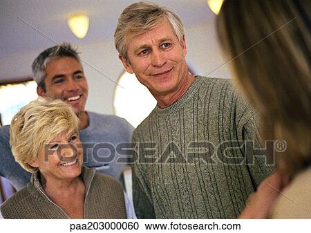 Stock Image - People talking together.. Fotosearch