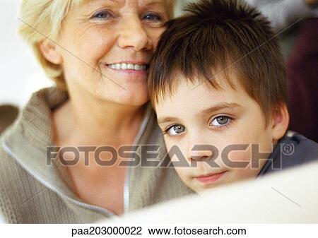 Stock Image - Senior woman and little boy, partial view, close up, portrait.. Fotosearch