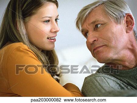 Teenage girl and senior man, head and shoulders, close up. View Large Photo Image Stock Image - Teenage girl and senior man, head and shoulders, close up.. Fotosearch