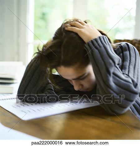 Boy leaning on table, hands on head View Large Photo Image Stock Photograph - Boy leaning on table, hands on head. Fotosearch