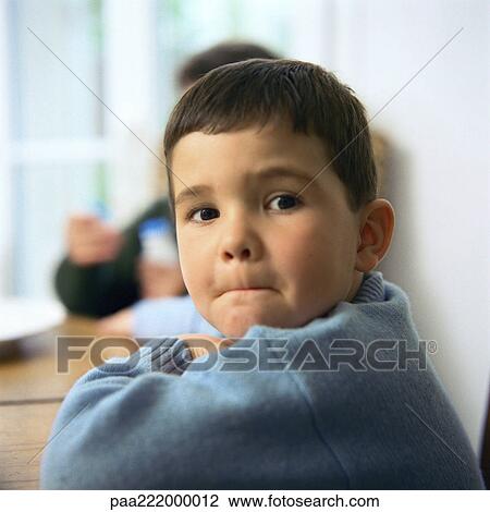 Boy looking over shoulder, portrait, second child in background View Large Photo Image Stock Image - Boy looking over shoulder, portrait, second child in background. Fotosearch