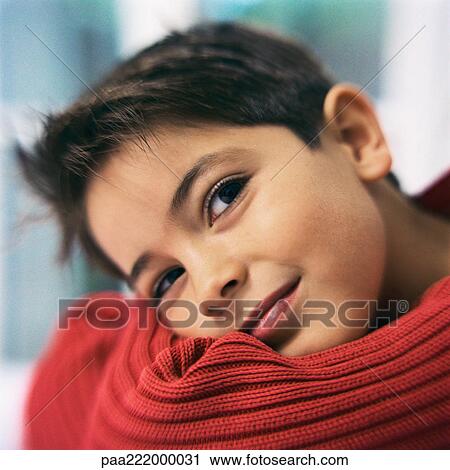 Boy smiling, head on arms, close-up View Large Photo Image Stock Image - Boy smiling, head on arms, close-up. Fotosearch