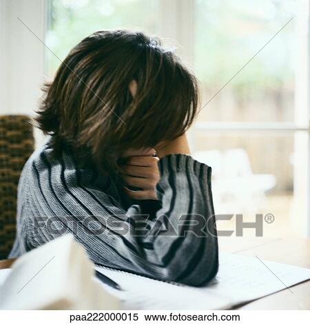Stock Photography - Child leaning on table. Fotosearch