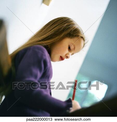 Girl writing, low angle view View Large Photo Image Stock Image - Girl writing, low angle view. Fotosearch