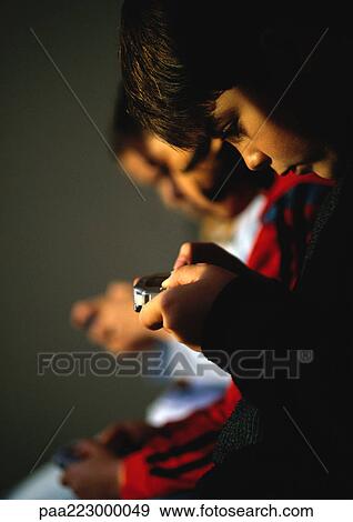 Children playing video games View Large Photo Image Stock Photo - Children playing video games. Fotosearch